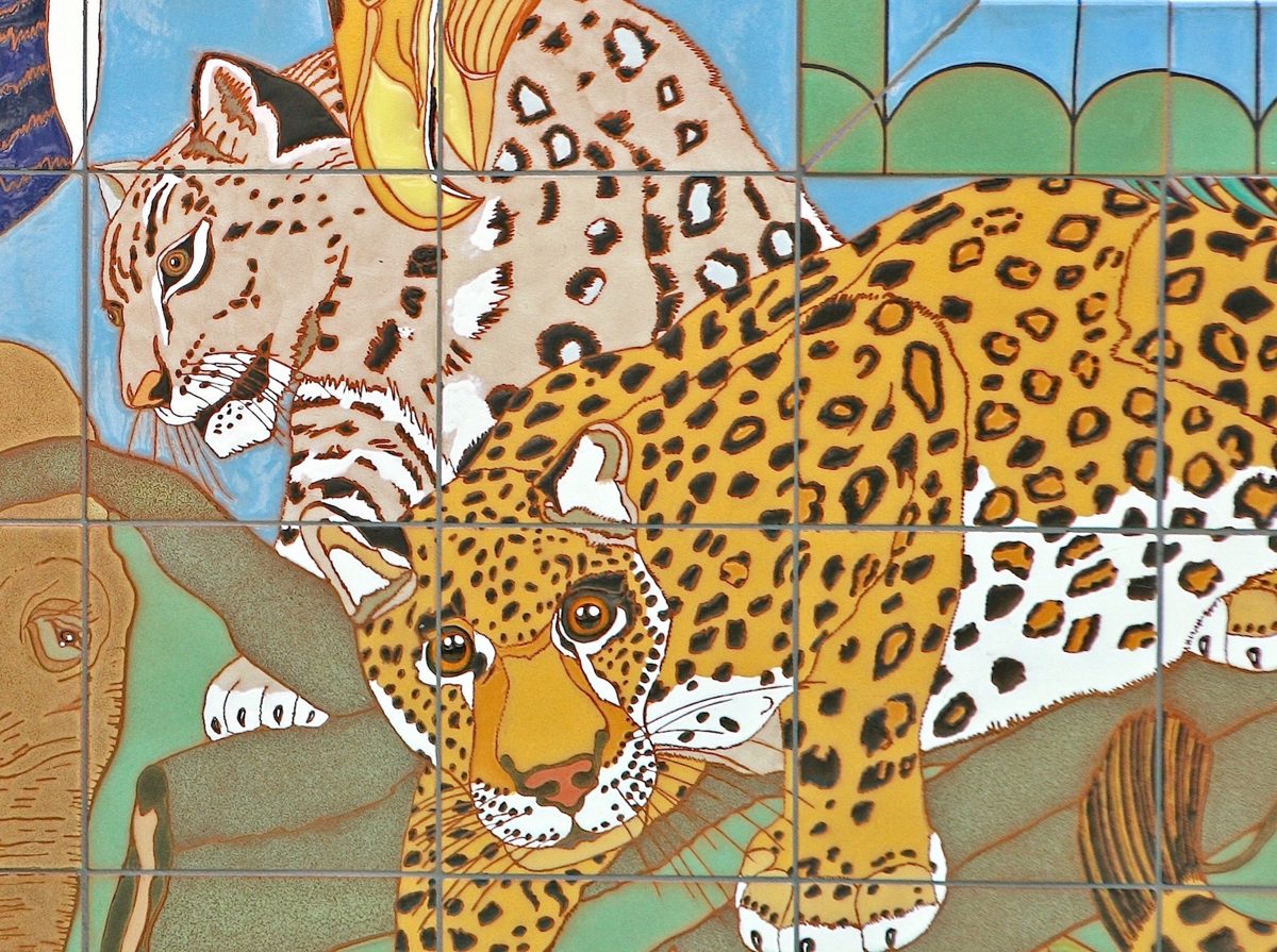 Detail: a jaguar crouched along a branch in the foreground, a snow leopard behind it, in glazed tile.