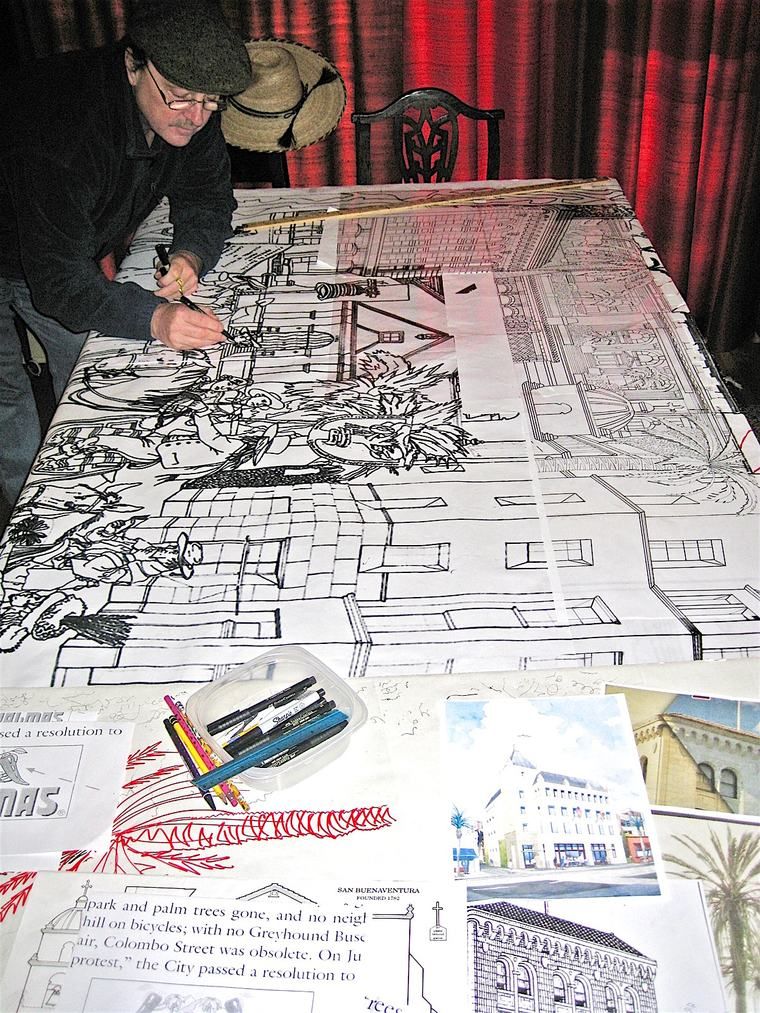 Michael O'Kelly inking a full-size pen-and-ink mural drawing in his studio.