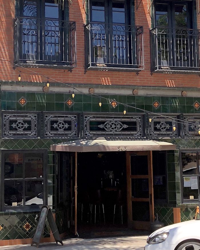 The Star Lounge storefront on Main Street: a deep green tiled shopfront beneath red brick.