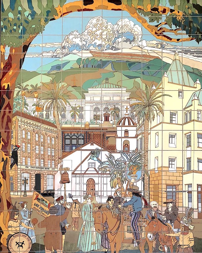 The upper register of Las Palmas: a nineteenth-century Ventura street scene in glazed tile with riders, palms and the Mission facade.