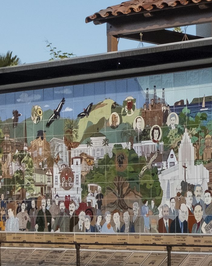 Detail of the Ventura Historic Mural beside the San Buenaventura Mission: a crowd of figures from the city's history in hand-glazed tile.