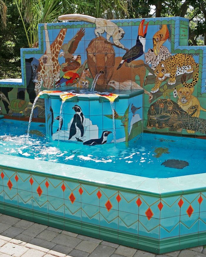 The Animal Kingdom Fountain at Santa Barbara Zoo: a turquoise tiled basin with penguins, a giraffe and a jaguar in glazed tile.