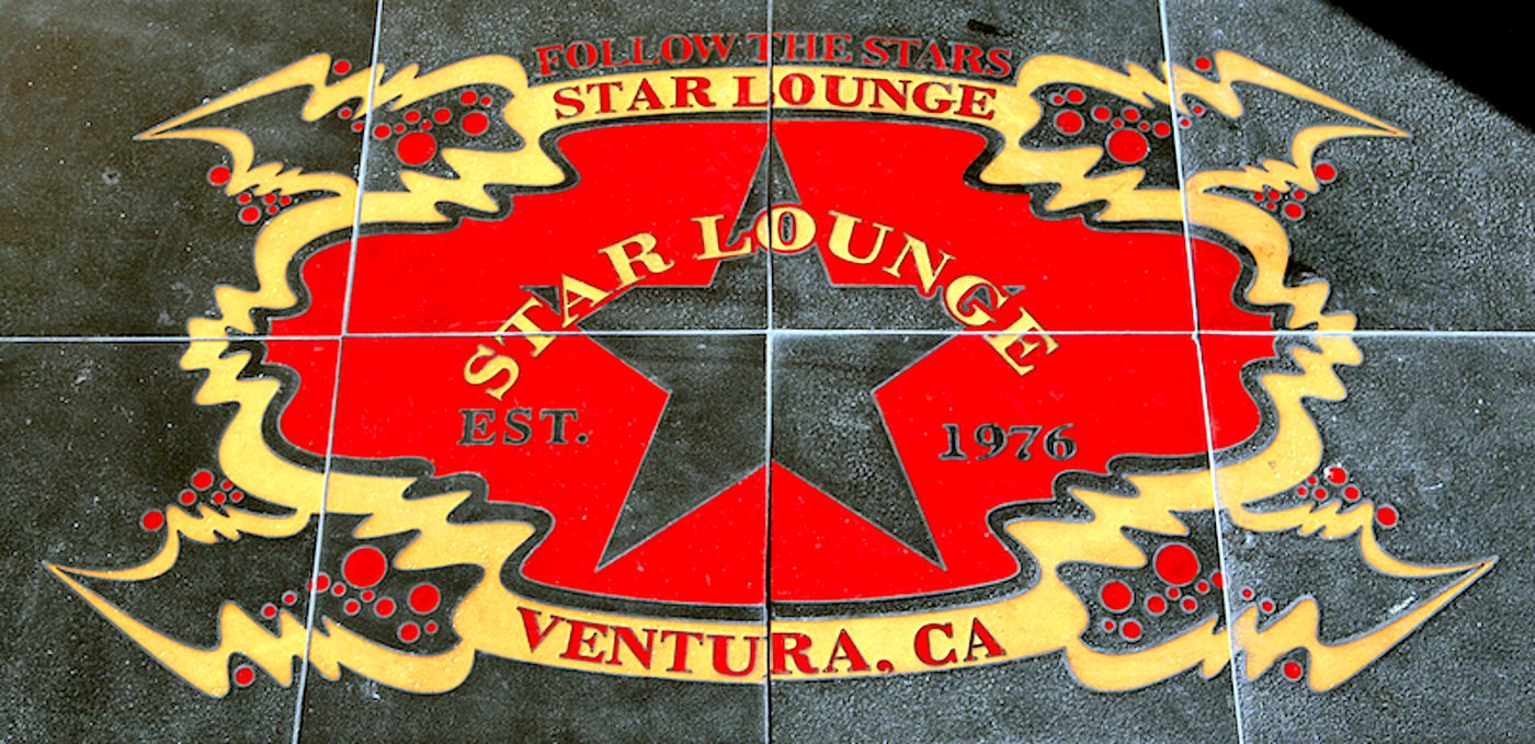 A tile medallion in the floor at the entrance: a red star inside a gold scalloped border, lettered Follow the Stars, Star Lounge, Est. 1976, Ventura, CA.