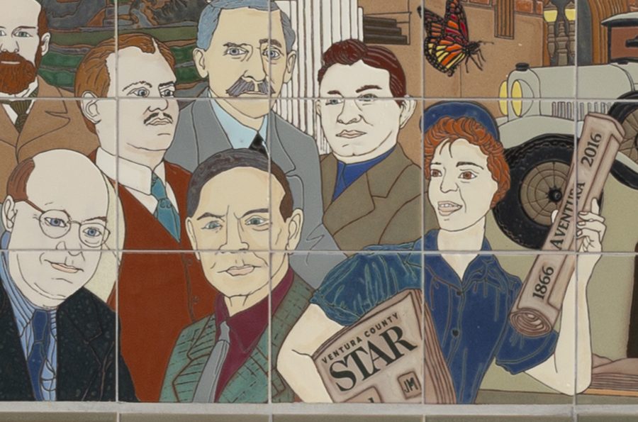 Detail: a crowd of townspeople, one holding a copy of the Ventura County Star and a rolled paper reading 1866 Aventura 2016.